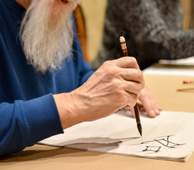 Calligraphy master drawing chinese hieroglyph