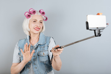 Funny senior woman taking selfie and smiling