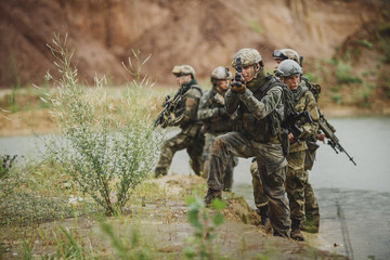 Portrait of a ranger in the battlefield with a gun
