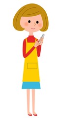 スマートフォンを触るエプロンの女性  