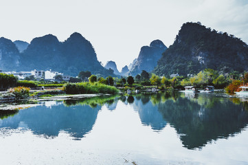 Fototapeta na wymiar The karst mountains and river scenery in the evening 