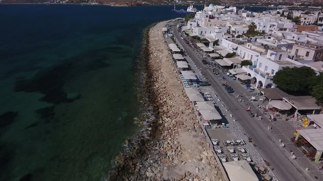 Aerial over coast and boulevard of Parikia, Greece.