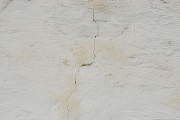 Wall fragment with scratches and cracks