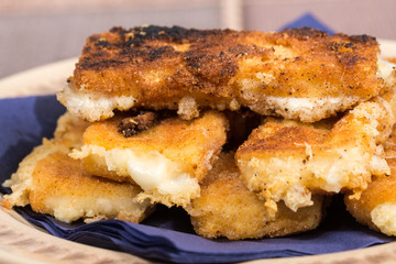 Delicious melting fried yellow cheese in eggs