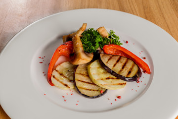 Grilled vegetables on a white plate