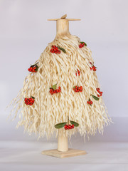  Christmas tree made of wood shavings with red berries 