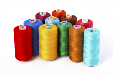 Still life ofcolorful spools of thread on a white background - Closeup Detail