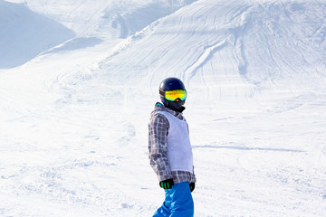 Young boy snowboarding on race