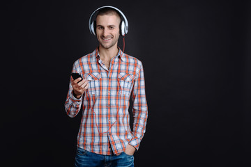 Cheerful smiling man wearing earphones