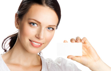 smiling businesswoman showing business or plastic card