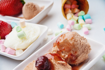 Ice cream sundae, strawberry and candies 