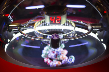 Colourful lottery balls in a lotto machine 42