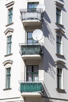 old house with balconies and satellite dish in Berlin Kreuzberg