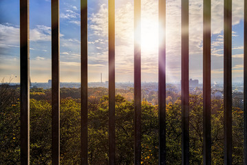 Skyline of Berlin seen through bars, Humboldthain