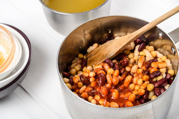 Preparing Chili Bean Stew On White Wood Kitchen Table