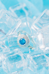 Silver ring with zircon and blue gemstone
