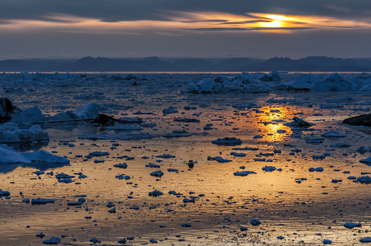 Sunset over Disko Bay in Grenland. Disko Bay is located in the western coast of Greenland and constitutes a wide southeastern inlet of Baffin Bay