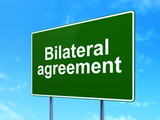 Insurance concept: Bilateral Agreement on road sign background