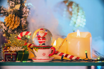 new year still life with Christmas motifs: candles, Santa, toys