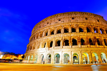 Fototapeta premium View of Colosseum at night in Rome, Italy