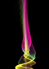 Colorful candle flame with smoke on the black background for art projects