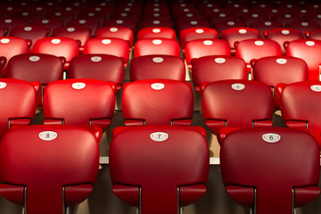 Numbers On Empty Red Chairs - 128512439