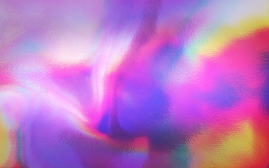 Obraz na płótnie Canvas An abstract colorful holographic futuristic texture.
