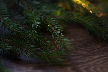 Christmas-tree branch on a wooden background