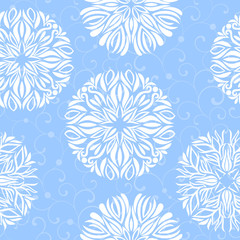 Seamless pattern with snowflakes on a blue background
