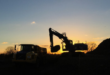 Excavator during sunset