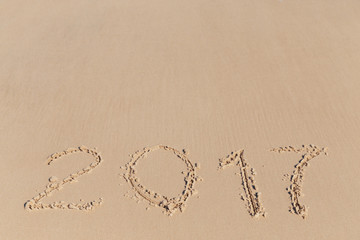 New 2017 Year sign on a sea coast sand