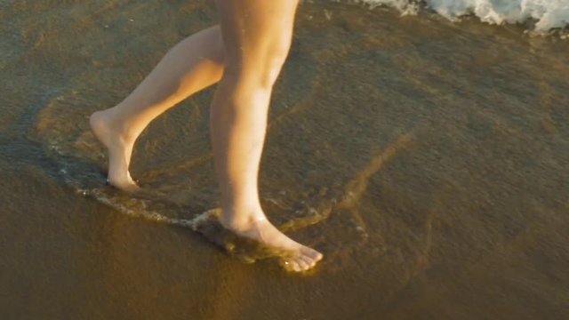 Walking alongside the waves at the beach. Best angle to take pictures of footprints. Splashing water on the feet can be refreshing and relaxing.