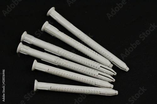 " Plastic dowels pin isolated on a black background " photo libre de