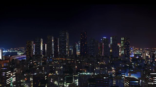Futuristic city skyline at night time.