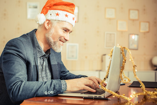 Modern Santa Claus Reads Letters Or HR Manager Prepares A Feast