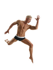 Blond athlete poses during jump. Isolated on white