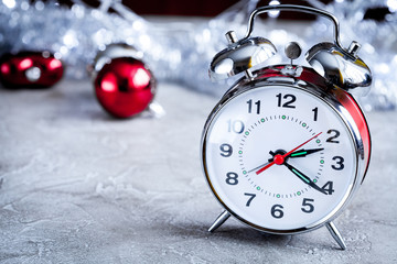 metal alarm clock and tree toys close up