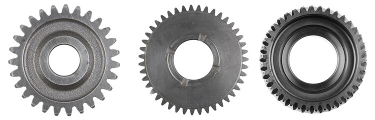 Three steel cog gears isolated over white