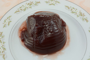 Canned cranberry sauce and juice on plate