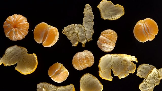 Frash tangerines on black background.