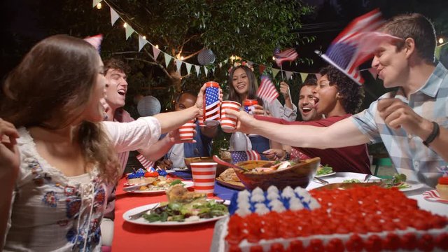 Friends Making A Toast To Celebrate 4th Of July At Party