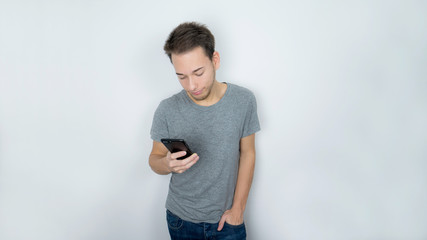 Teen boy looking at his phone