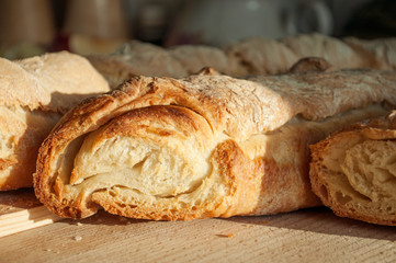 Homemade french baguette on a wooden surface