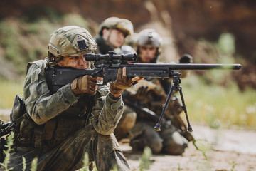 Portrait of a ranger in the battlefield with a gun