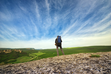 Fototapeta premium Traveler on top of mountain. Nature and adventure composition.