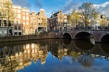Obraz premium Dutch scenery with canal and mirror reflections at spring, Amstardam, Netherlands, toned