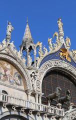 Fototapeta na wymiar Basilica of San Marco with the great winged lion symbol of the C