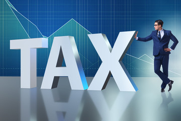 Businessman in high taxes concept