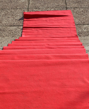 elegant long red carpet on the stairs at the vip fashion show