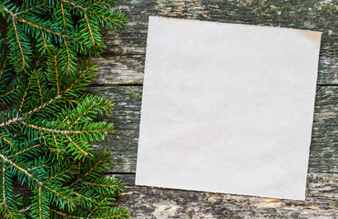 Christmas fir tree with decoration on a wooden board